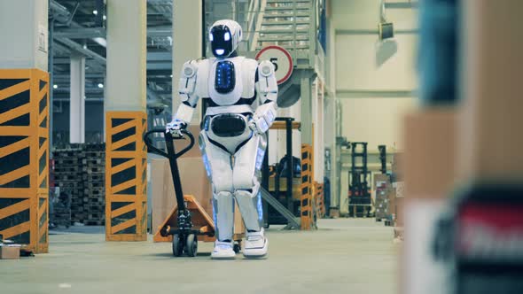 Warehouse Robot Pulling a Cart Loaded with Cardboard Boxes