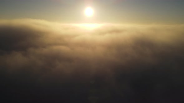 Aerial of the sunrise above the clouds