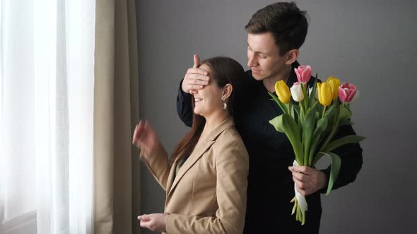 Surprised Woman Receive Tulip Flowers From Her Boyfriend