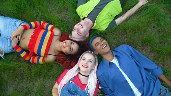 Joyful Multiracial Friends Lying Park Grass Together, Youth Freedom Connection