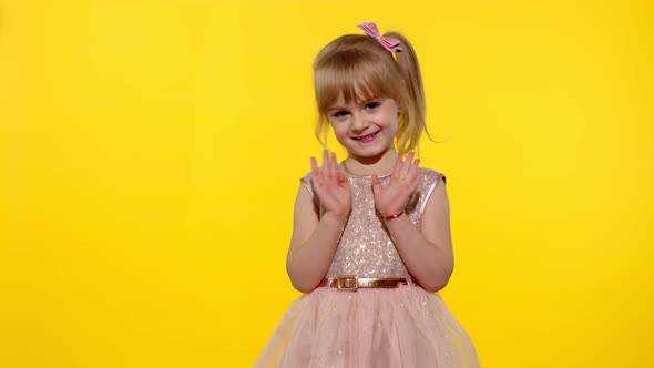 Friendly Little Blonde Child Kid Girl Waving To the Camera Doing Hello or Bye Gesture. Slow Motion