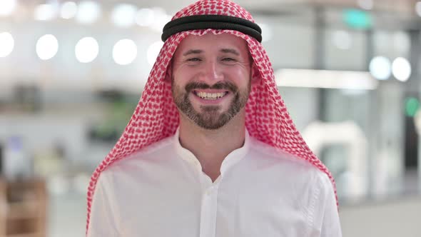 Smiling Arab Businessman Looking at Camera 