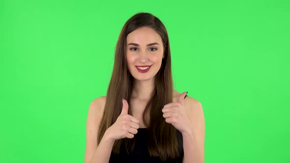 Young Cheerful Woman Showing Thumbs Up, Gesture Like. Green Screen