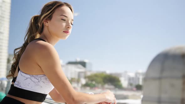 Beautiful woman standing on the beach 4k