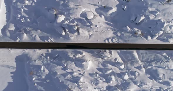 Overhead Vertical Aerial Above Snowy Road with Cars