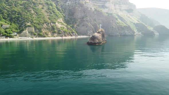 Aerial View From Above on Calm Azure Sea and Volcanic Rocky Shores