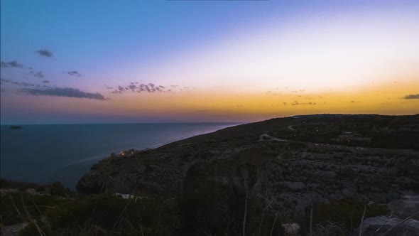 Mixture of hues during sunset time from Blue Grotto, Malta, time-lapse