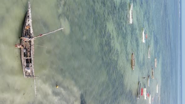 Tanzania Vertical Video  Boat Boats in the Ocean Near the Coast of Zanzibar Aerial View