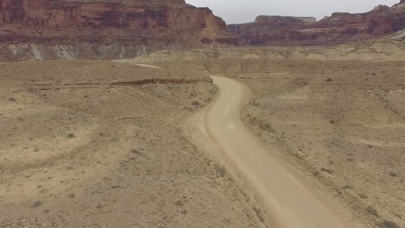 Aerial view of winding dirt road through the San Rafael Swell