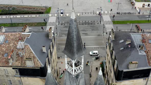 Bordeaux city gate at Porte-Cailhau overlooking the Garonne river in France, Aerial dolly out reveal