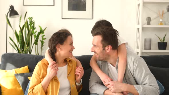 Portrait of Cheerful Spouses and Two Kids