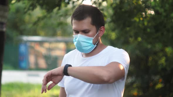 Portrait Sports Man in Protection Medical Face Mask Doing Workout Exercises During Coronavirus