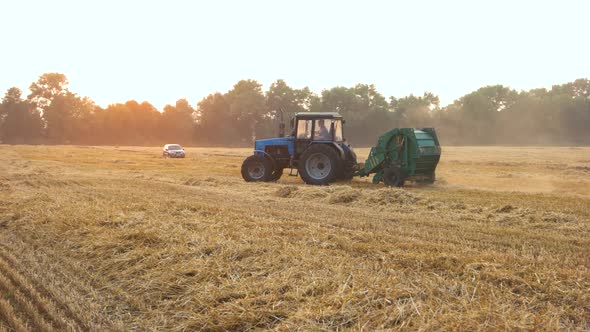 Blue Tractor Riding Around on the Field.