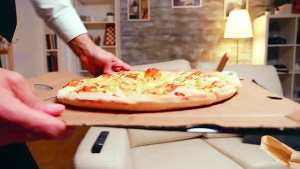 Businessman Arriving Home with Pizza After a Long Day at Work