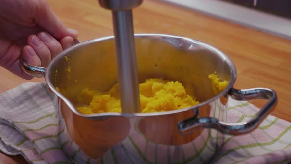Preparing healthy mashed sweet potato with coconut milk. Clip represents healthy paleo eating, autoi