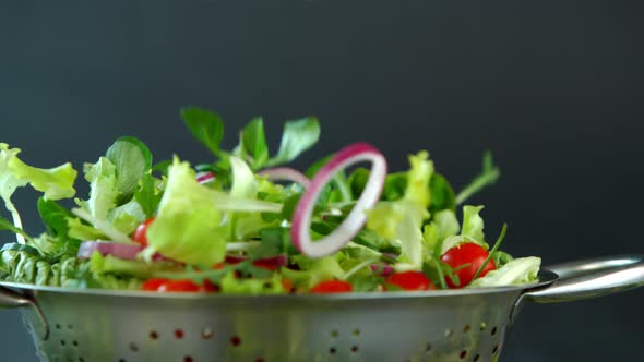 Fresh Salad Flying to Colander in Super Slow Motion