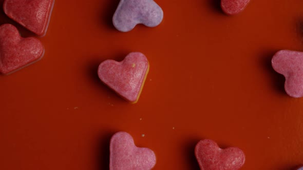 Rotating stock footage shot of Valentines decorations and candies - VALENTINES 0090