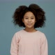 Portrait of cheerful little girl with curly hair smiling funny and telling something carefree - VideoHive Item for Sale