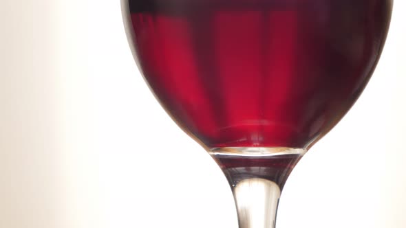 Slow tilt on glass of red rubin color wine in the glass  3840X2160 30fps UltraHD footage - Glass wit