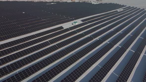 Closeup View From Top on Solar Panels Power Station in Desert at Winter Morning