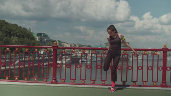 Fit Female Doing Warm Ups During Outdoor Training