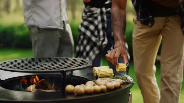 Focused Man Chef Preparing Bbq Vegetables Outside