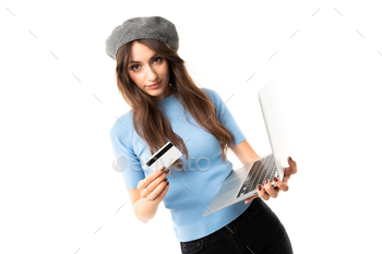 Cheerful woman with long hair holds a money card and phone isolated on white background