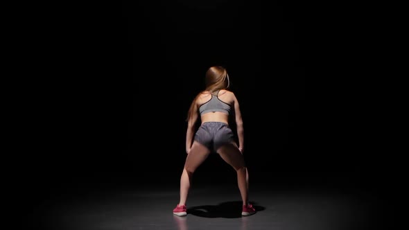 Model with Sporty Slender Body Dancing Twerk Her Buttocks. Studio