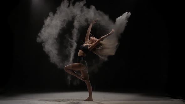 Sensual Woman Throwing Dust Particles in Air. Slow Motion