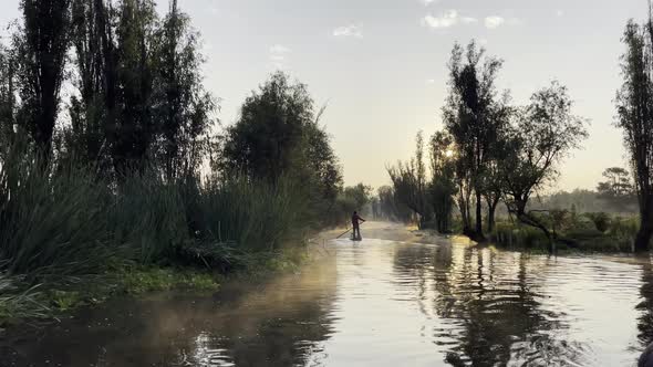 Beautiful Sunrise during Magic Hour at Xochimilco, Mexico City 01 - Man in Silhouette on Trajinera (