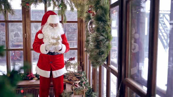 Santa Claus in beautiful room. Portrait of Santa Claus decorating his room