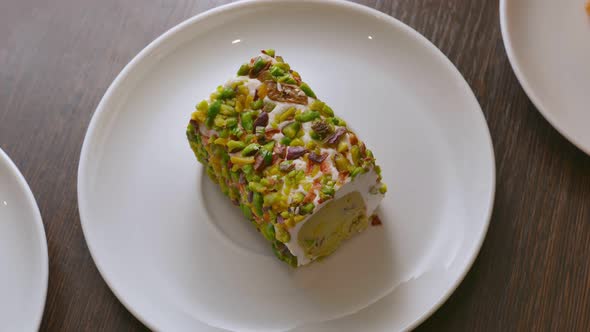 Sweet Pistachio Dessert on a White Plate