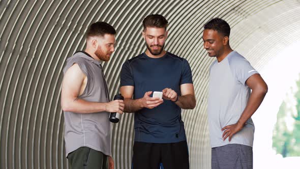 Sporty Men or Friends with Smartphone Outdoors