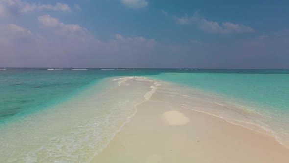 sandbank washed down into the horizon washed from two sides by the purest turquoise water against a