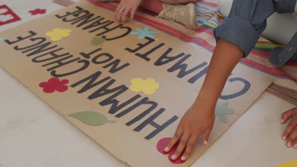 Making Slogan Sign against Climate Change