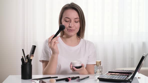 Woman Doing Makeup at Home Online Beauty Blogger Presenting