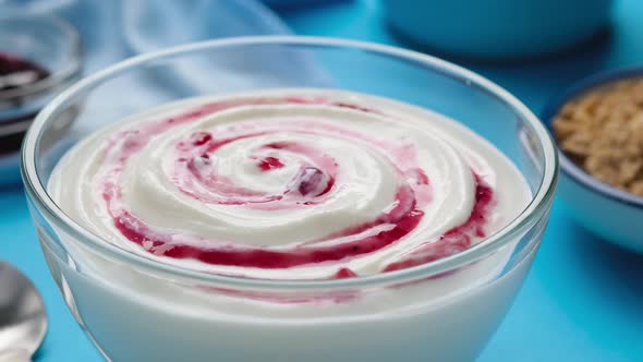 Yogurt with berry jam, blueberry whipped cream