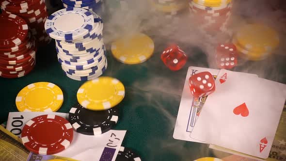 Gambling Red Dices Poker Cards And Money Chips In Smoke 6