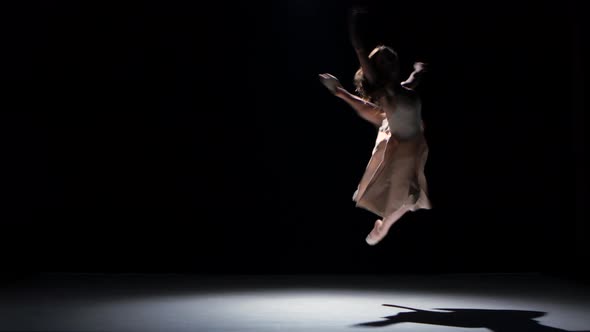 Young Woman Dancer Dancing Contemporary Dance Moves, on Black, Shadow