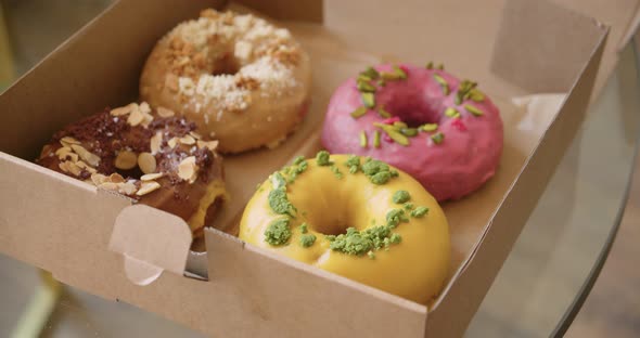 Delicious Sweet Colorful Donuts in Takeaway Box