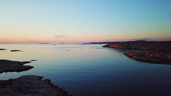 Drone flying over Swedish waters during sundown