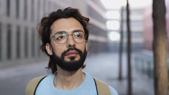 Confident Successful Young Adult Hipster Man Looking at Camera in City Street