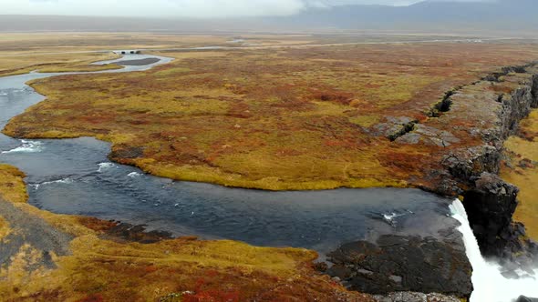 Aerial View Autumn Landscape in Iceland, Rocky Canyon with Waterfall