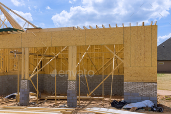Building wooden framework for new house under construction