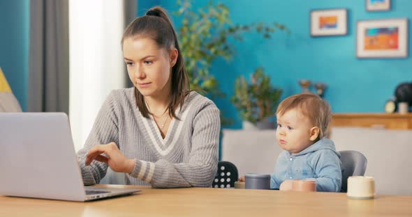 Tired Fulltime Mom Spends Long Hours at Desk Filling Out Reports Filing Documents Organizing Files