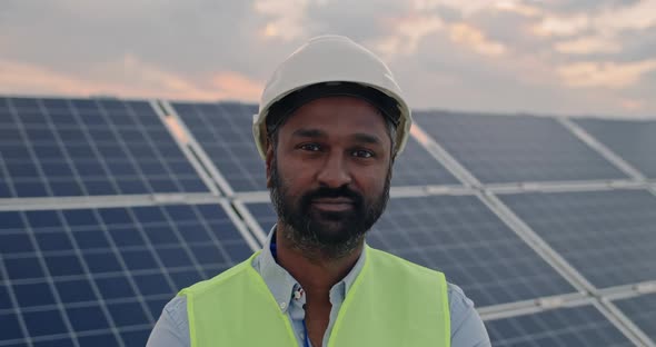 Portrait of Mixed Raced Male Engineer in Hard Helmet Looking To Camera. Bearded Man in Uniform