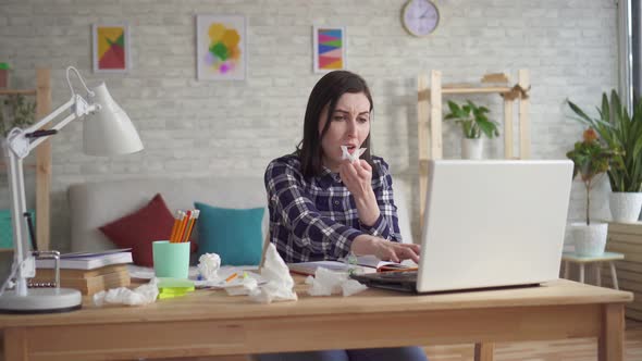 Severe Allergic Reaction a Young Woman Sneezing Into a Disposable Handkerchief