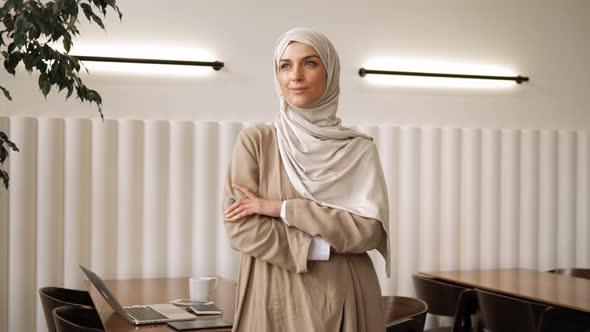 Muslim Woman on Remote Working Online Education or Video Conversation in Caffe