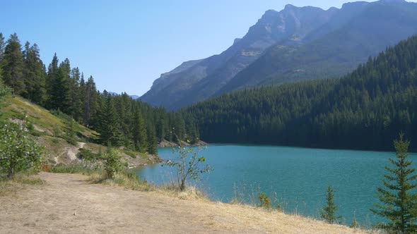 Pan right view of hills and a lake