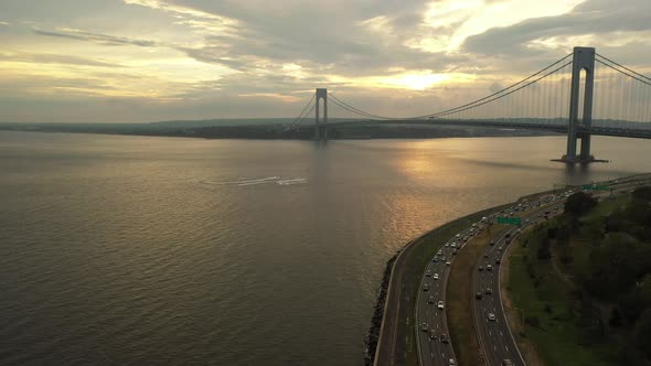 An aerial view over by the Belt Parkway in Brooklyn, NY. The drone camera ascends and dolly out whil